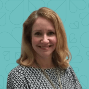 Headshot of Victoria Houle on a teal background.