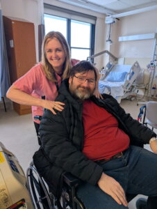 A patient sitting in a wheelchair and a Bowmanville Hospital staff member.