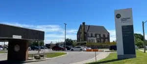 Lambert House on stilts moved to other side of the parking lot at the Bowmanville Hospital.