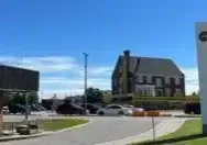 Lambert House on stilts moved to other side of the parking lot at the Bowmanville Hospital.